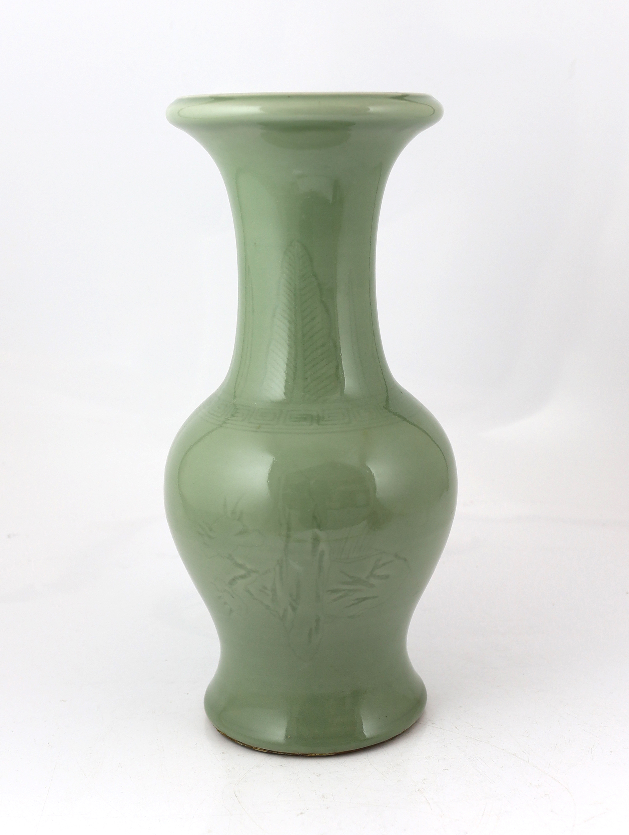 A Chinese carved celadon glazed yen-yen vase, 19th century, base drilled